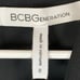 BCBGeneration Black Lace Inlay Sleeveless Pocket Romper NWT Size 0 FLAW