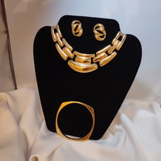 Vintage signed Napier gold-tone pierced earrings, bracelet and pendant