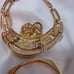 Vintage signed Napier gold-tone pierced earrings, bracelet and pendant