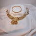 Vintage signed Napier gold-tone pierced earrings, bracelet and pendant