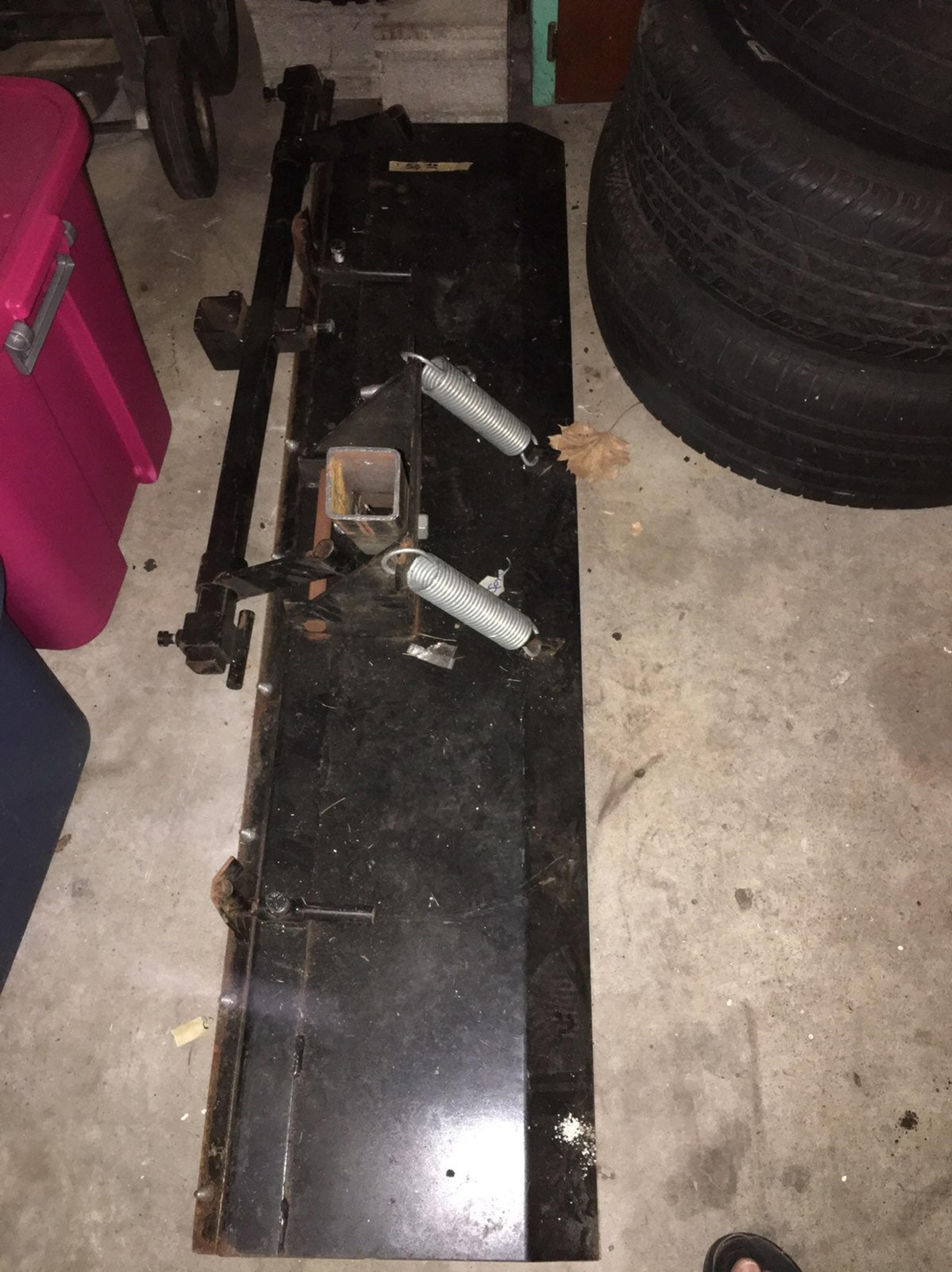Snow plow attaches to 4 wheeler