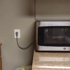 Microwave 950 watts GE 2 years old clean black and stainless steel.