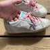 Woman’s golden goose shoes