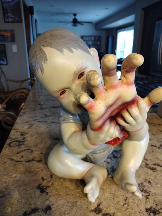 Spirit Halloween zombie baby - Snackin' Steve