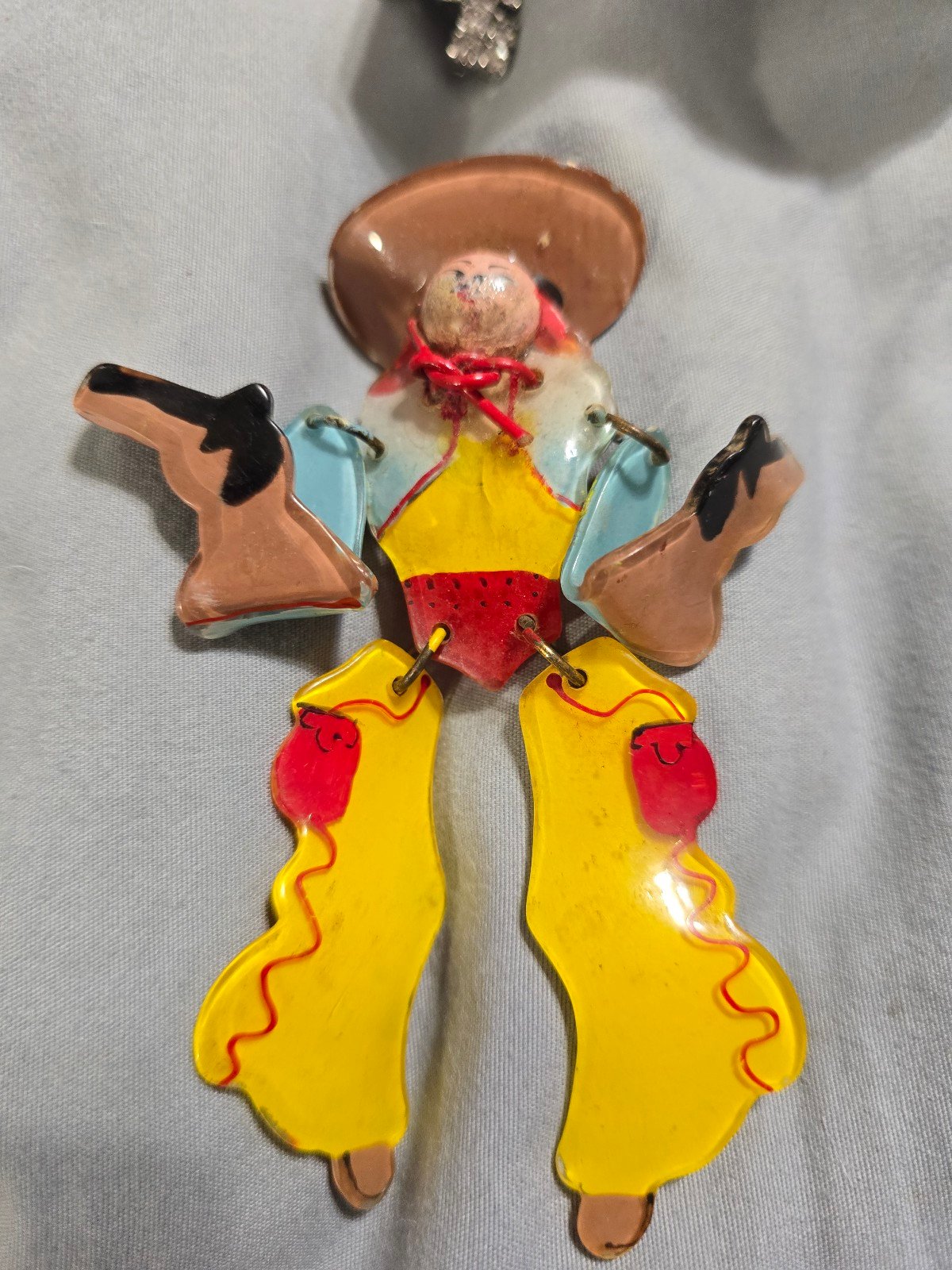 Vintage Celluloid articulated Cowboy pin