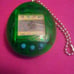 Clear Green Tamagotchi With Blue Buttons