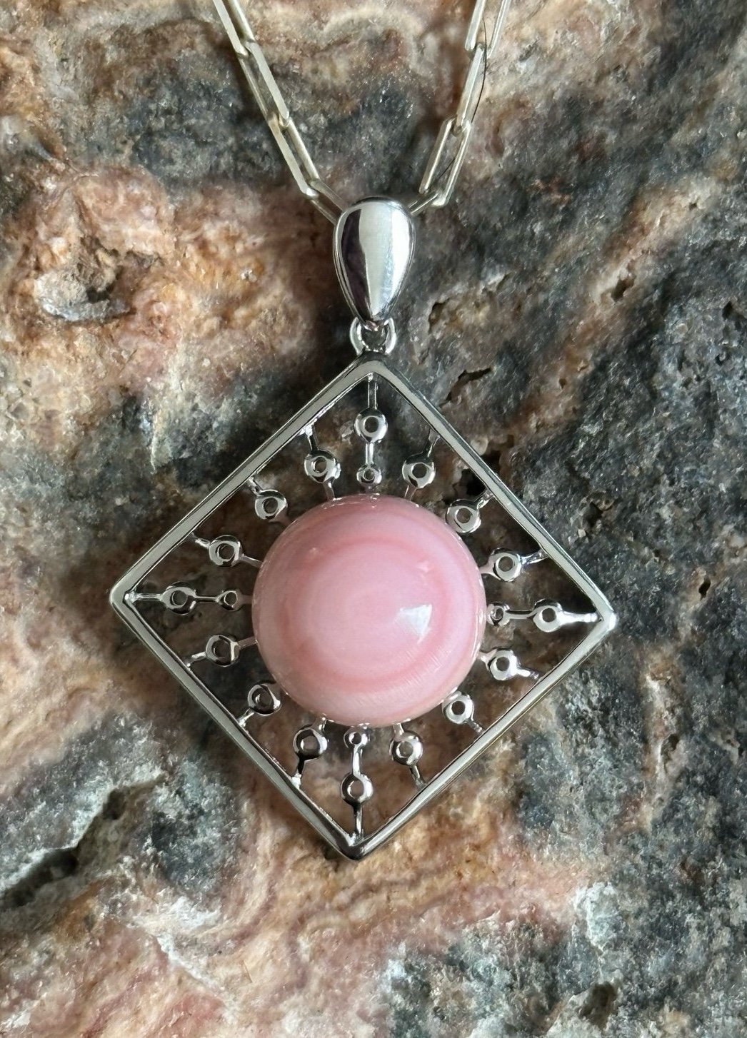 Pink conch orb sterling silver pendant