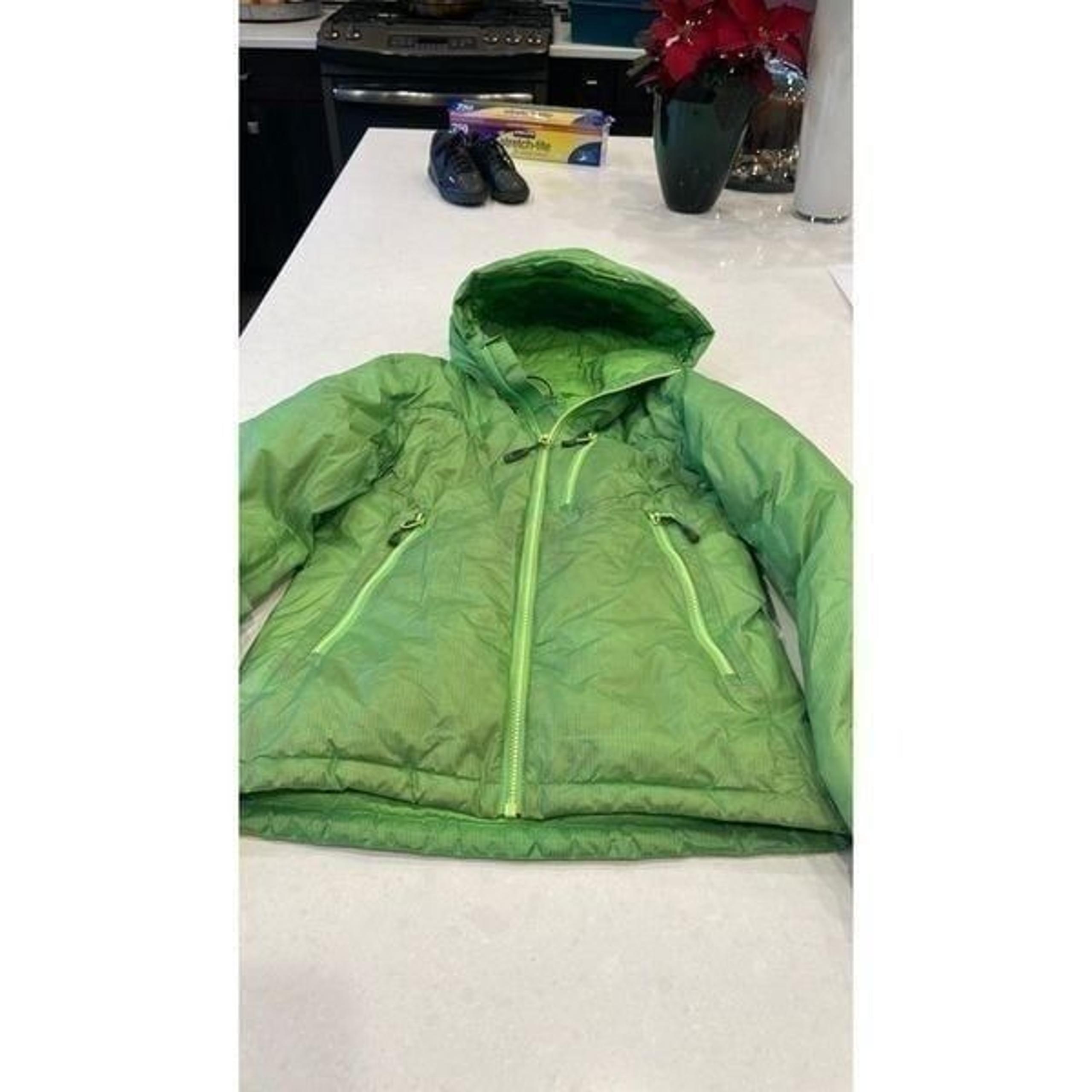 Outdoor research women’s jacket xs pertex  shield+ 800, patch on back elbow.