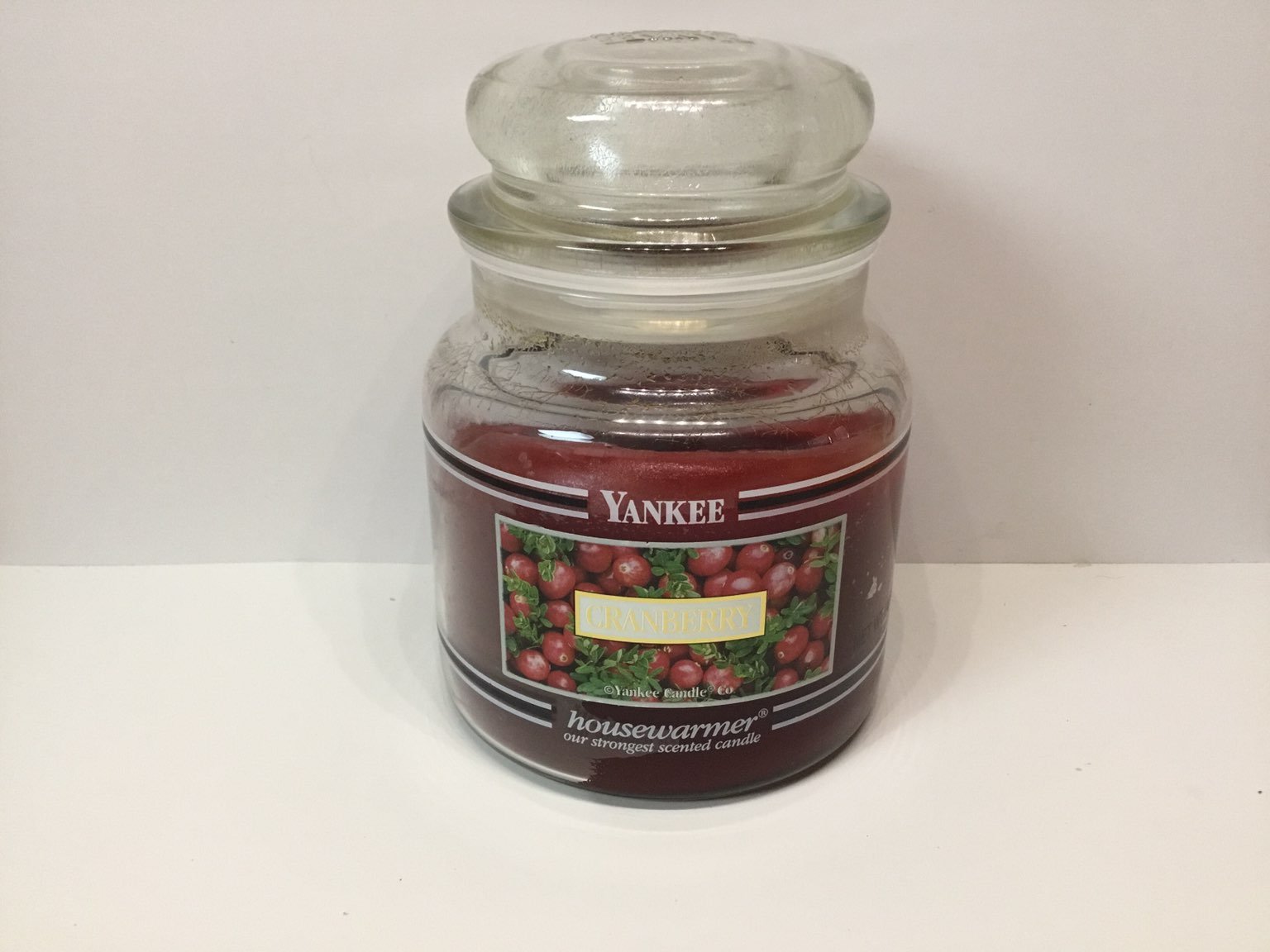 Yankee Candle cranberry black band medium jar 60% full