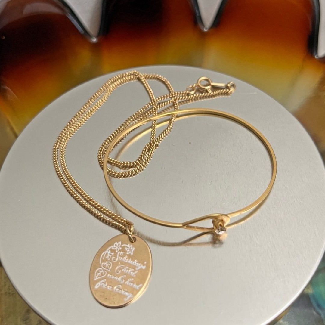 Vintage Avon gold set Saturday’s child works hard for a living & dainty bracelet