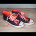 Neon orange and purple chuck taylors
