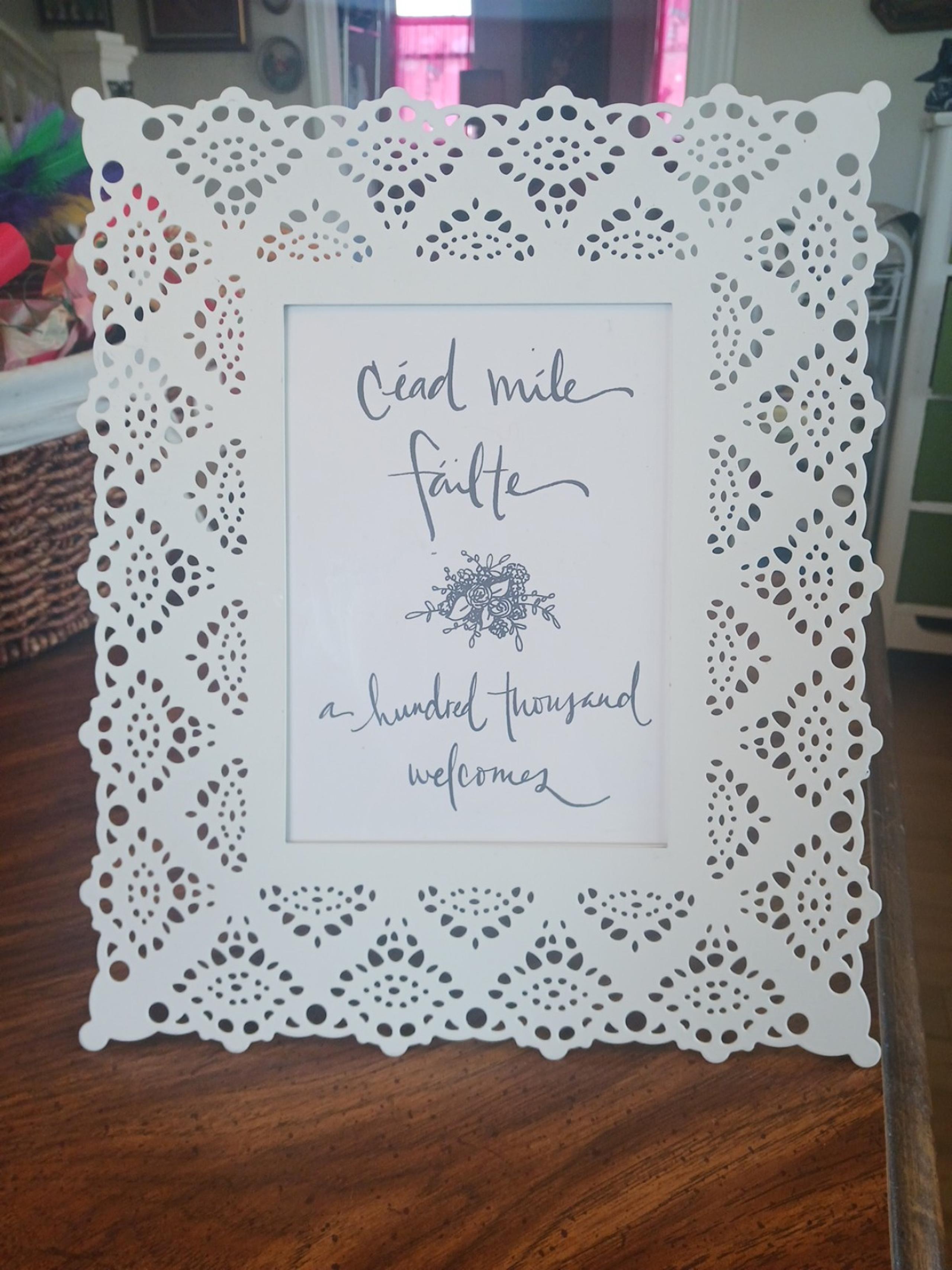 Large white metal ornate lace cutouts photo frame by Ikea, plastic back