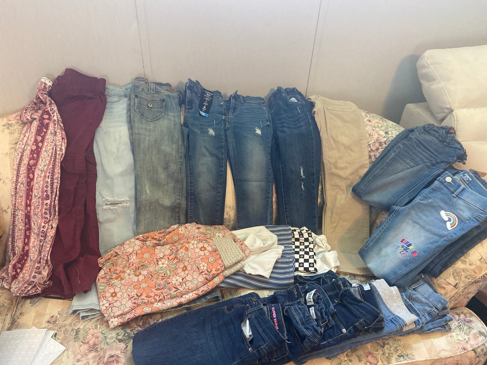 17 pair of jeans and 2 rompers sizes 6 - 10