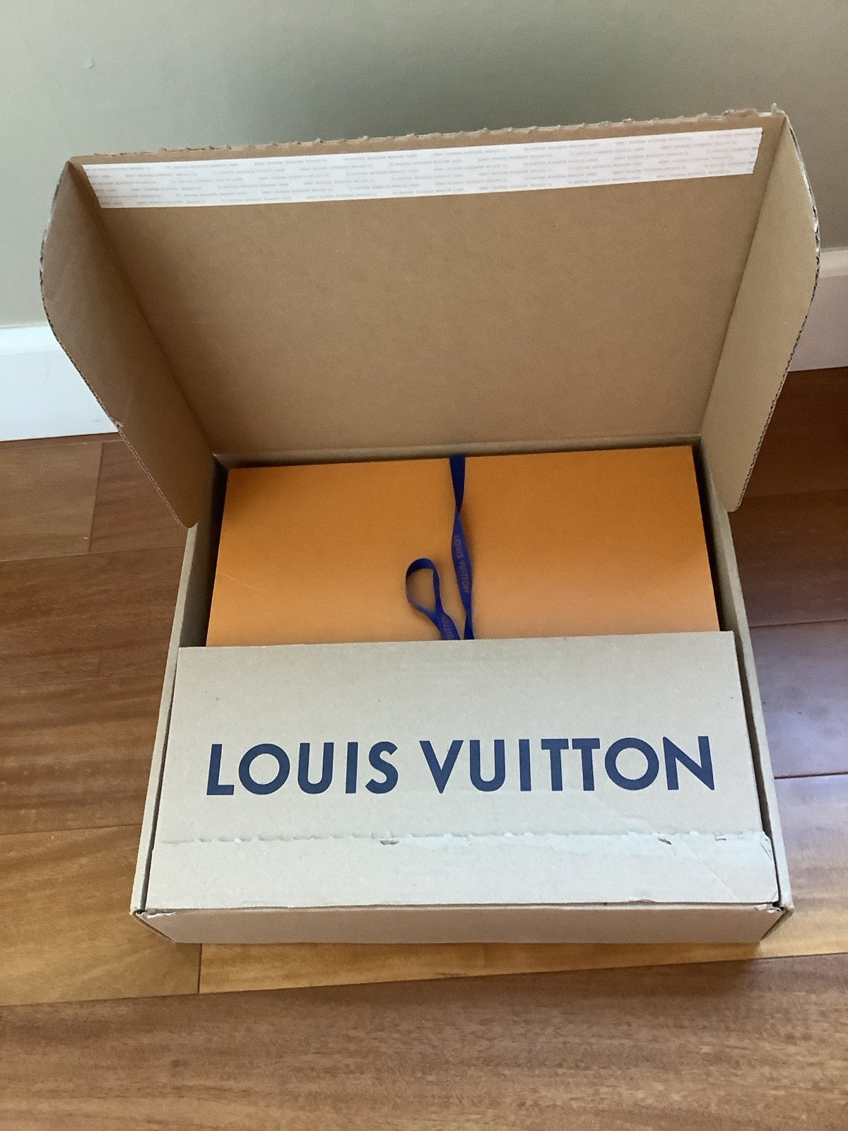 Louis Vuitton boxes and ribbon