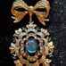 Gorgeous Golden Bow with Blue Stones
