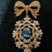 Gorgeous Golden Bow with Blue Stones