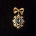 Gorgeous Golden Bow with Blue Stones