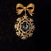 Gorgeous Golden Bow with Blue Stones