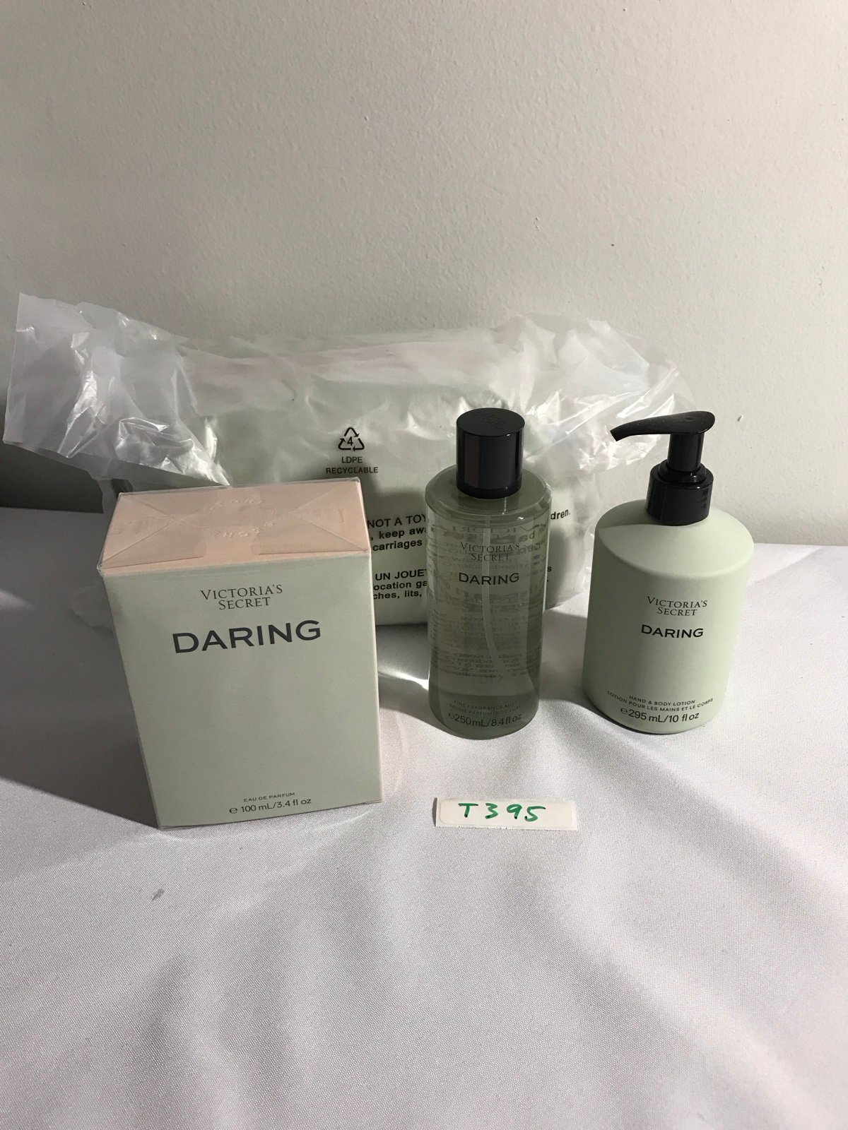 3.4 fl oz Victoria’s Secret Daring Eau De Parfum, + lotion +mist+cosmetic bag,