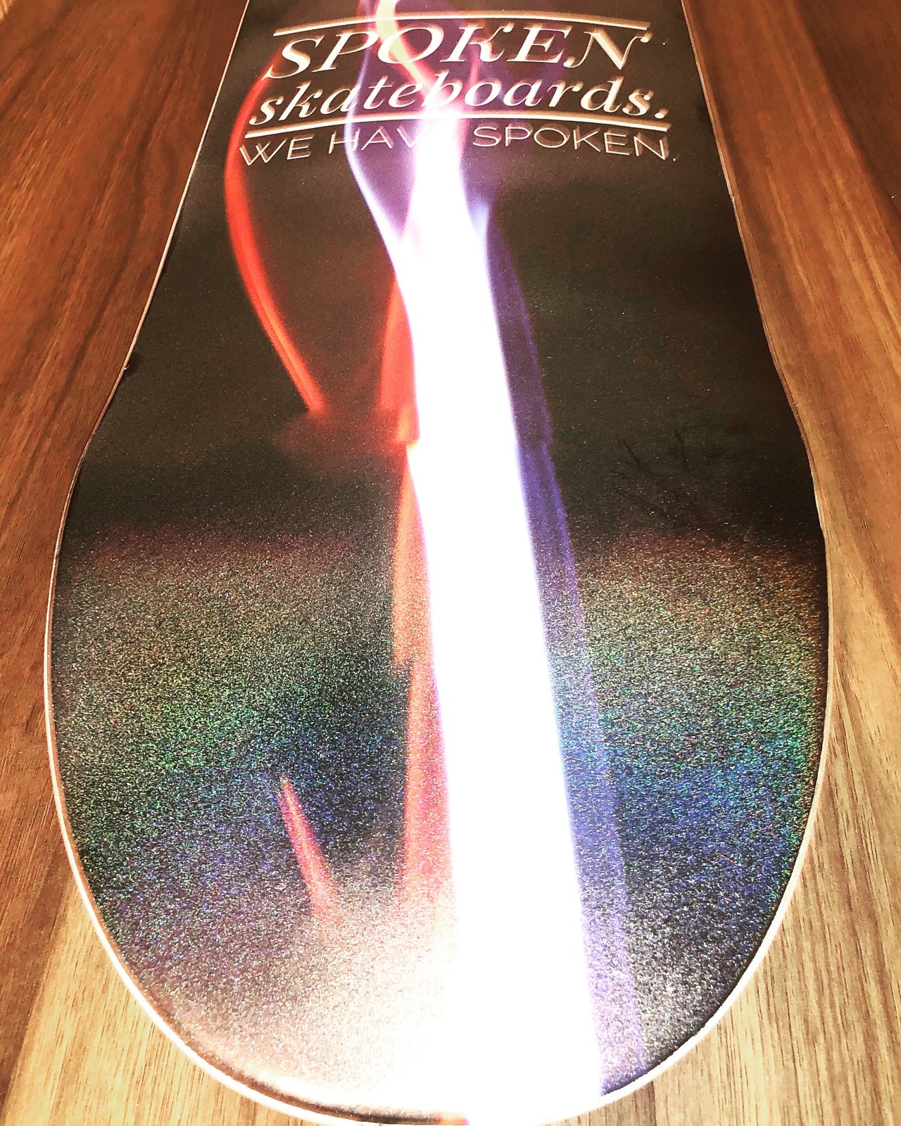 Spoken skateboards- holographic smoke and fire deck with black griptape