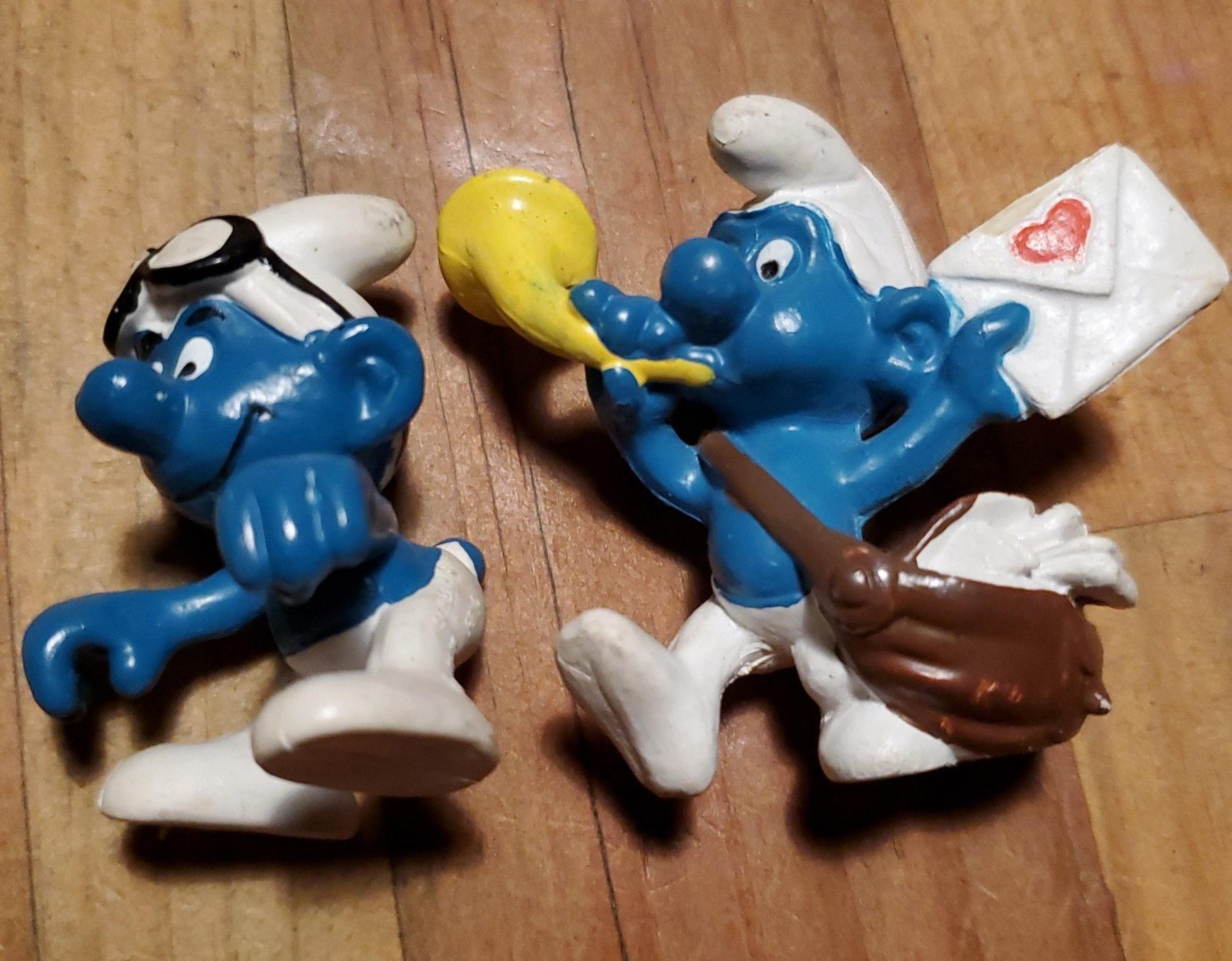 3 smurfs mini figures and smurfette