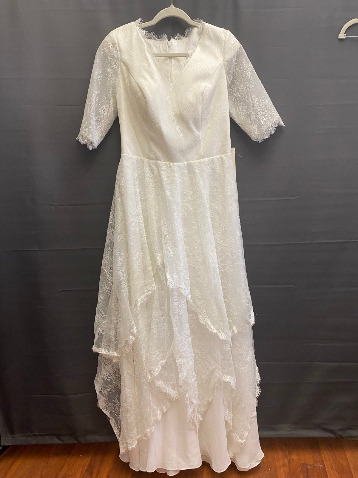 Women’s Medium/large lace wedding Dress New with tags beautiful and modest