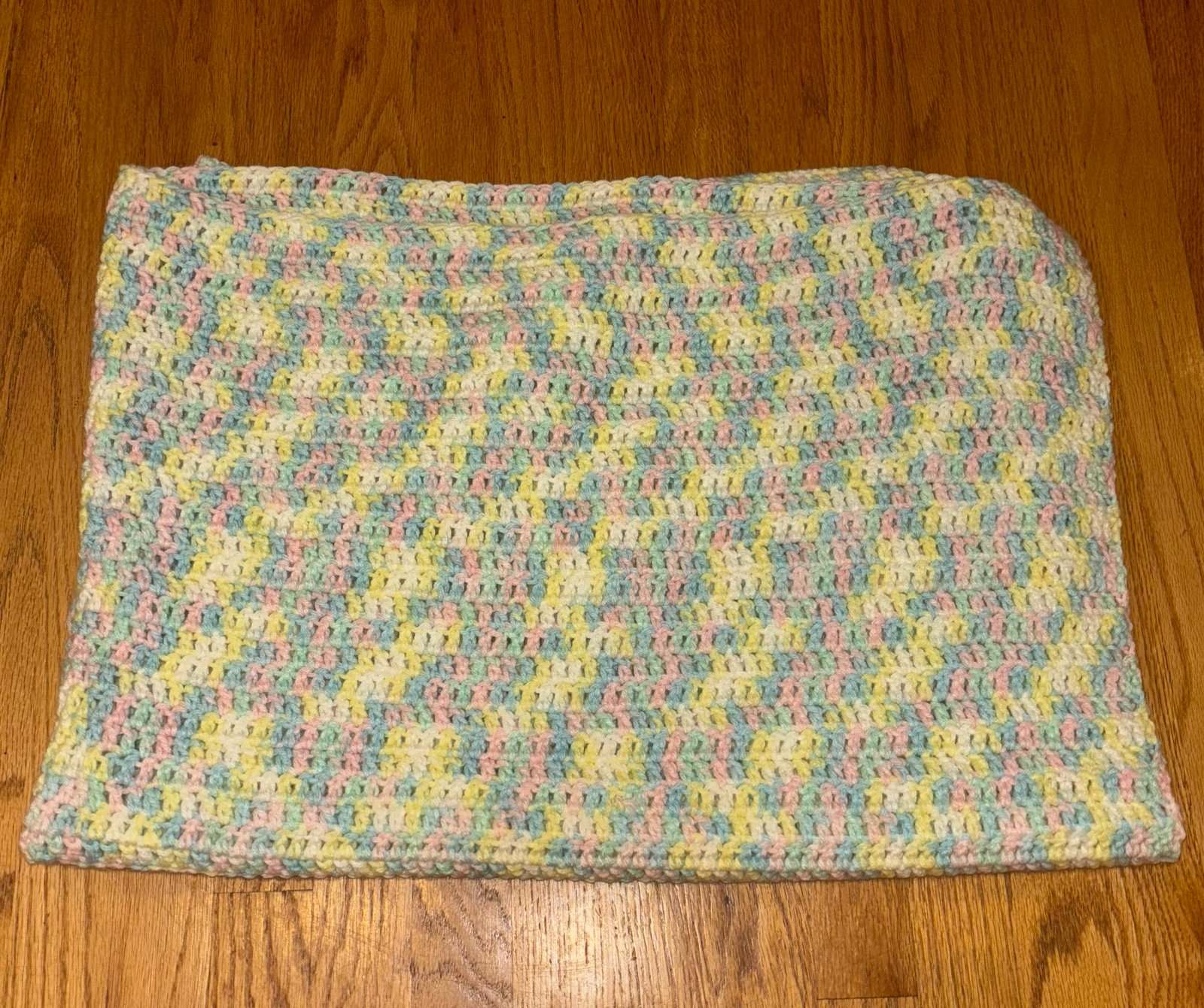Crocheted handmade baby blanket pink yellow blue & white