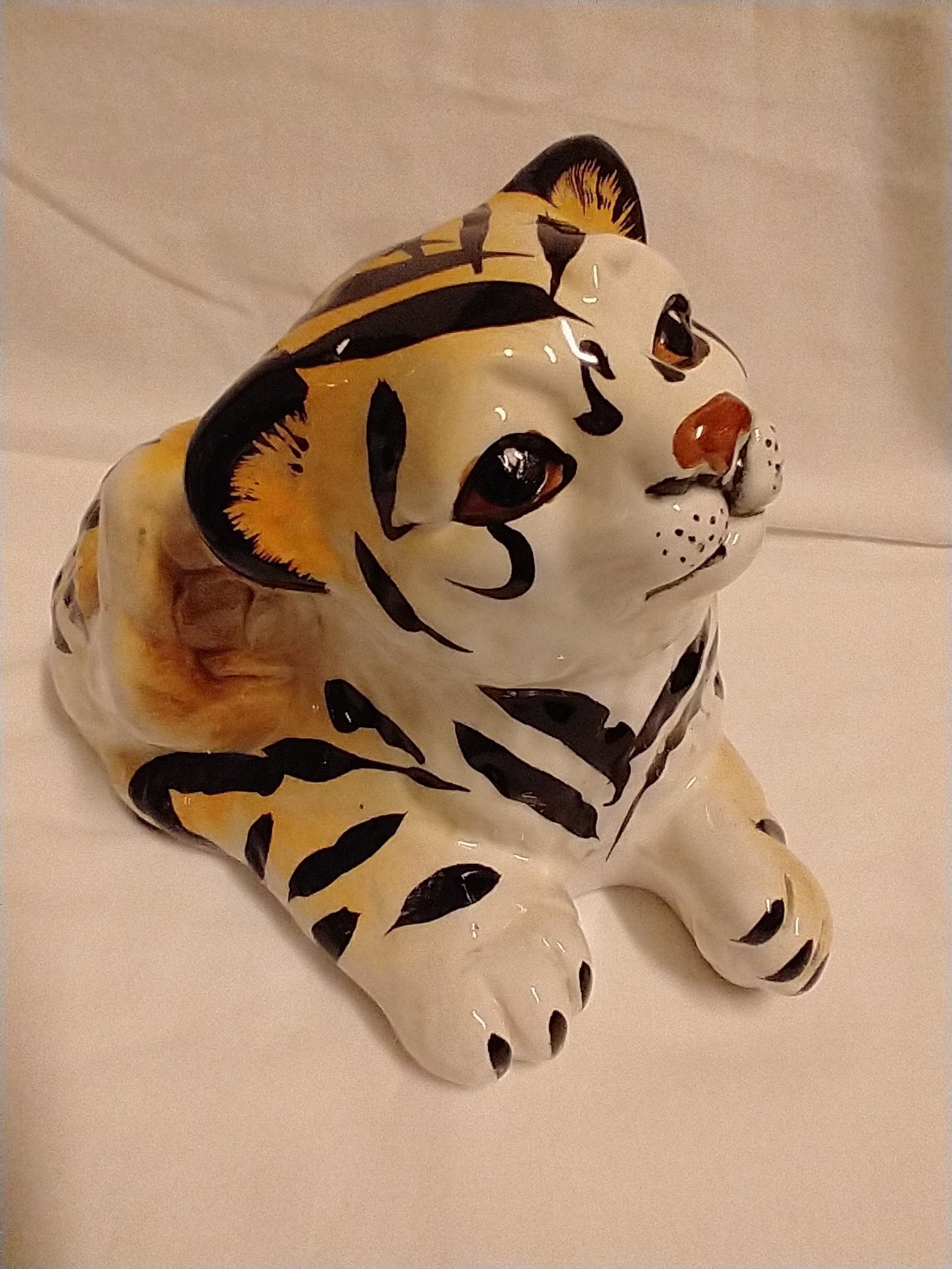 Vintage cub tiger scratching it's ear