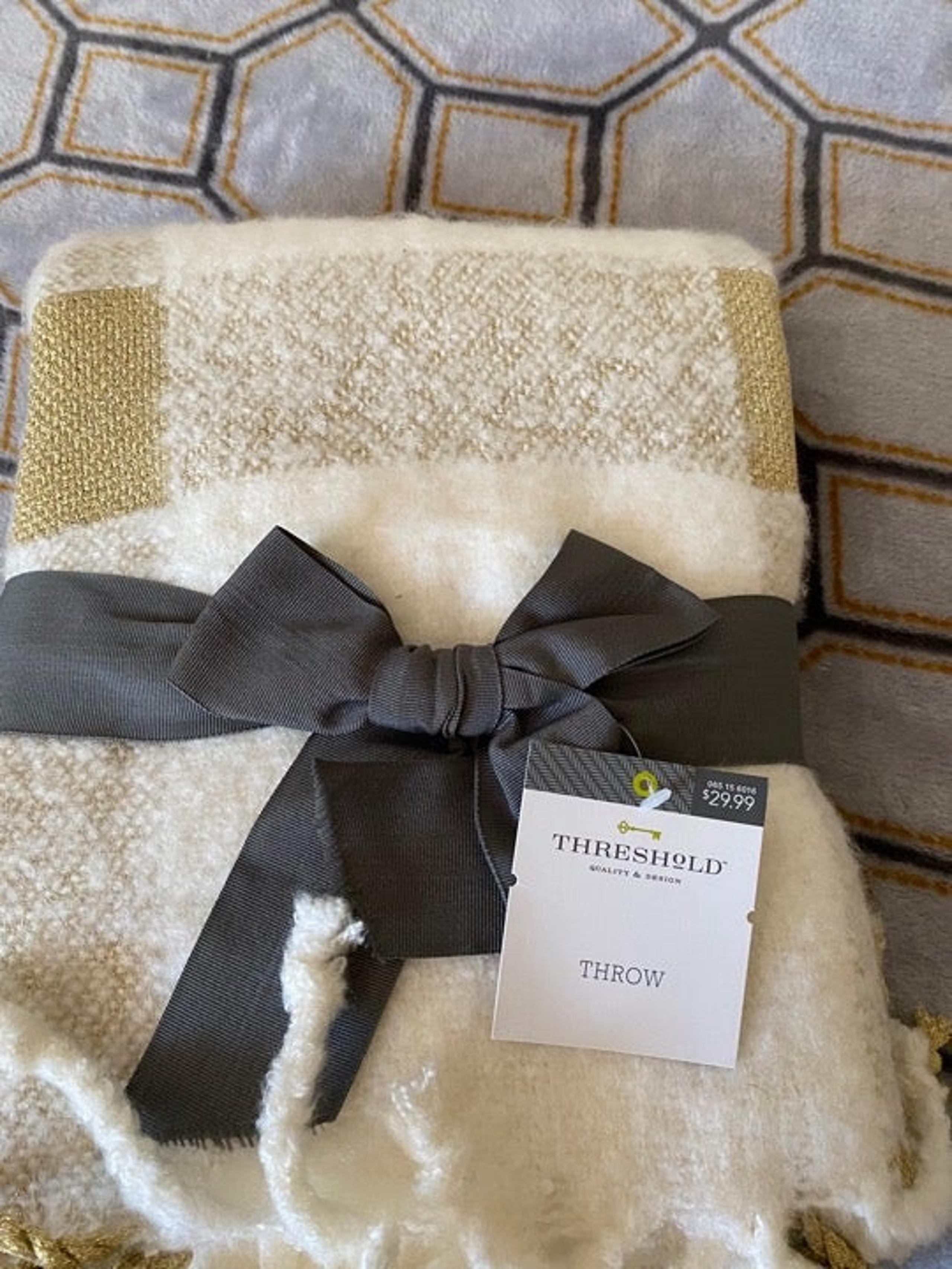 New throw blanket, white with golden thread throughout