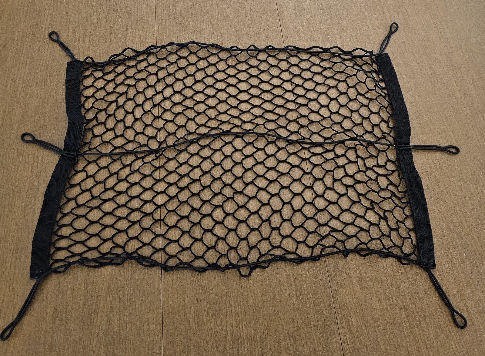 Universal Automobile Cargo Net with 6 Elastic Tiedown Loops.