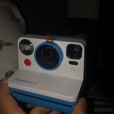 Polaroid camera with film