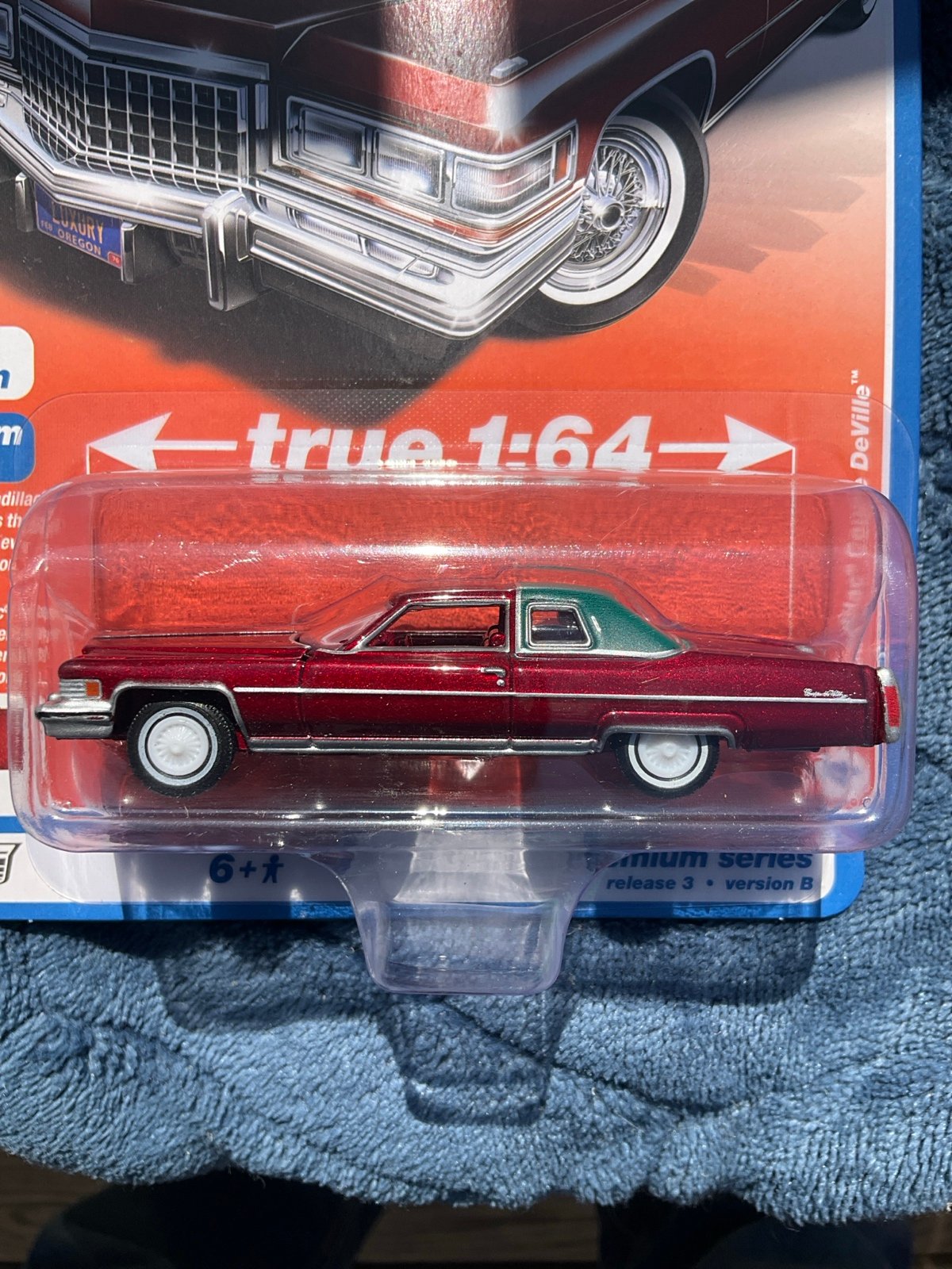 Auto World ULTRA RED CHASE TH 1975 Cadillac® Coupe DeVille™ (PG2)