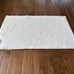 A soft and plush reversible mat
