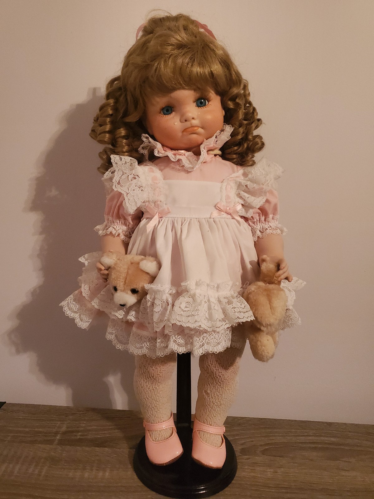 Porcelain doll - Crying girl with broken teddy bear