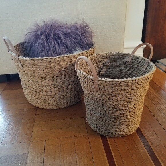 2 wicker baskets with leather handles
