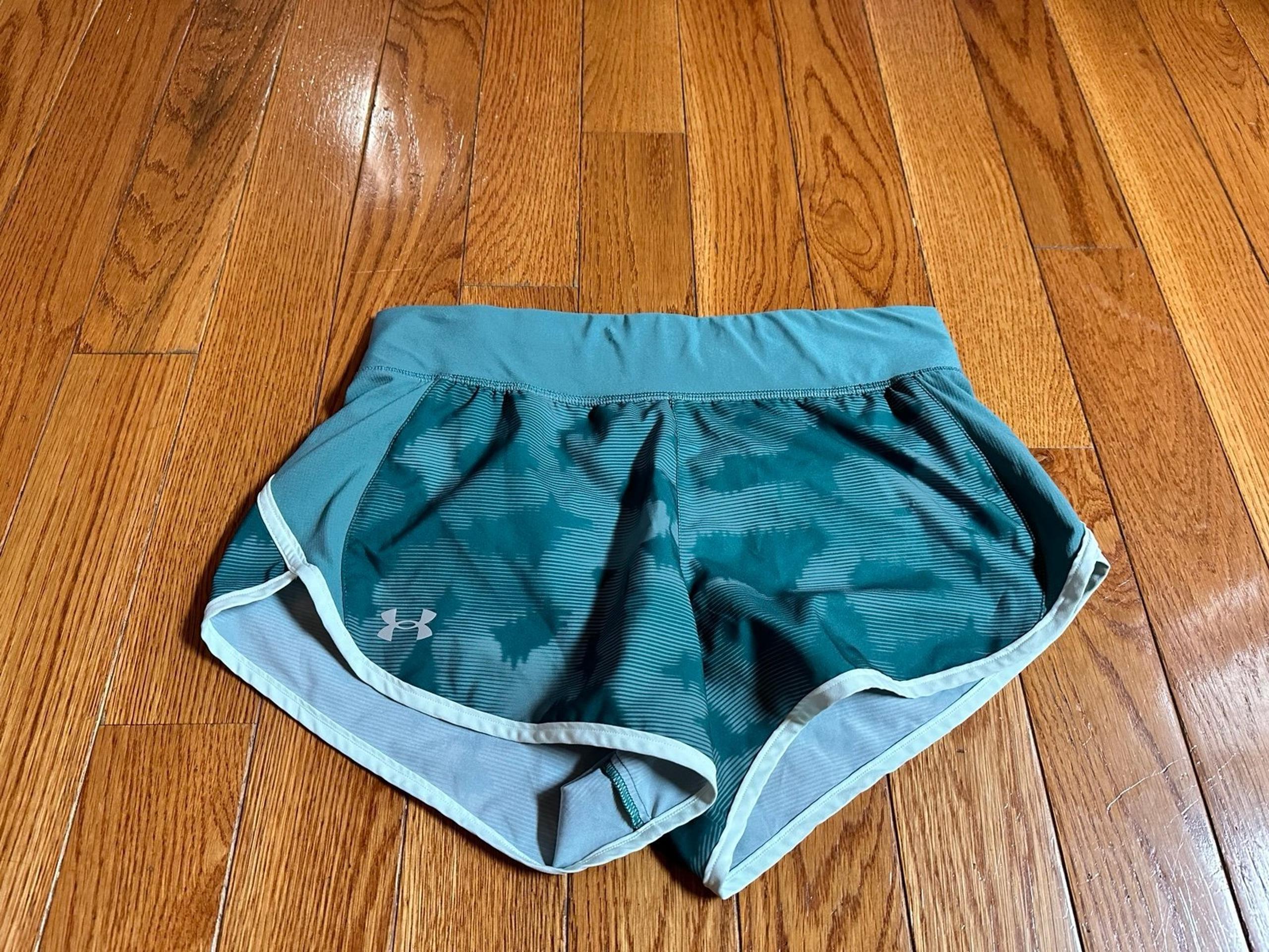 Under Armour Women's Fly-By 2.0 Shorts
Size medium 
Color turquoise& white 
$35