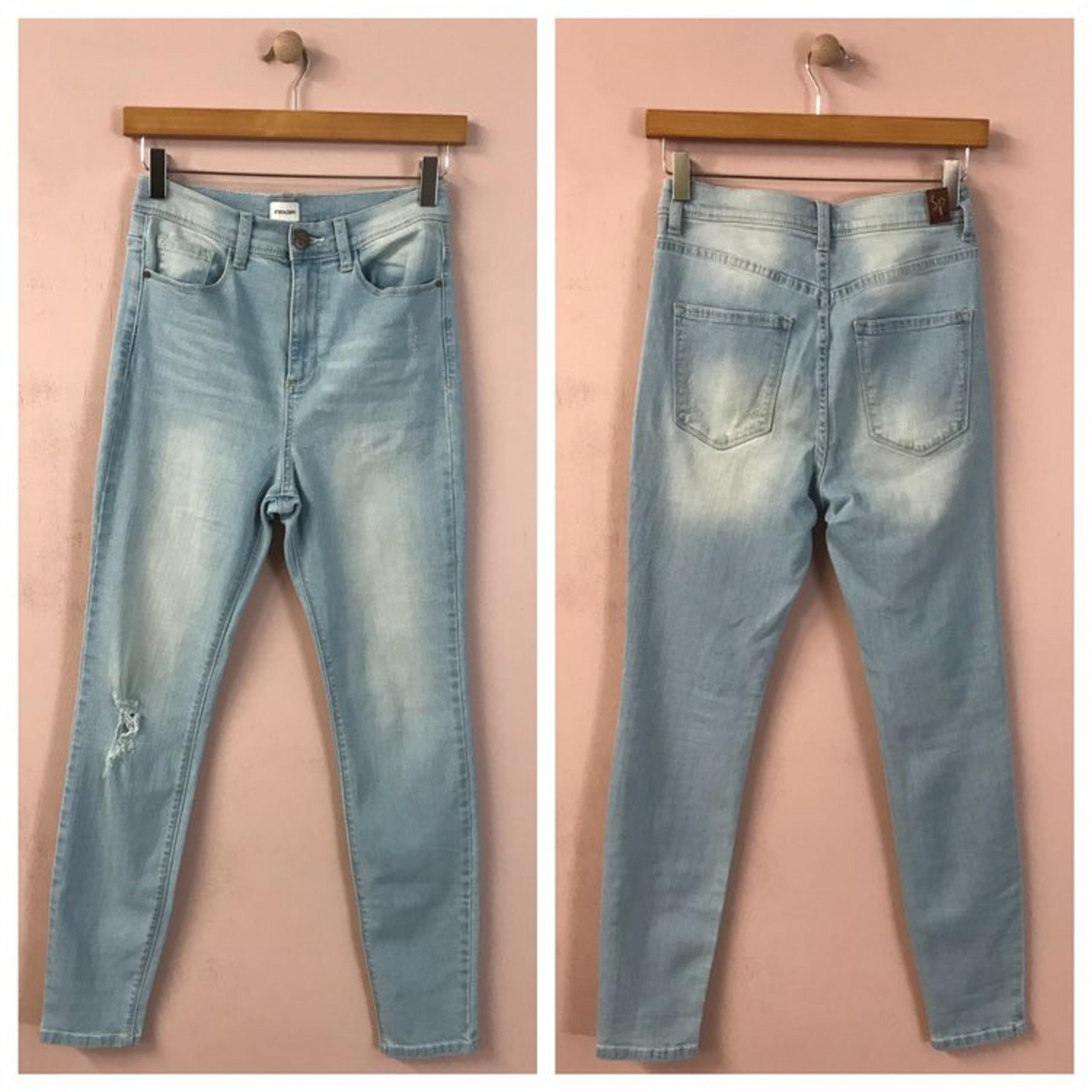 Sneak Peek High Rise Skinny Jeans