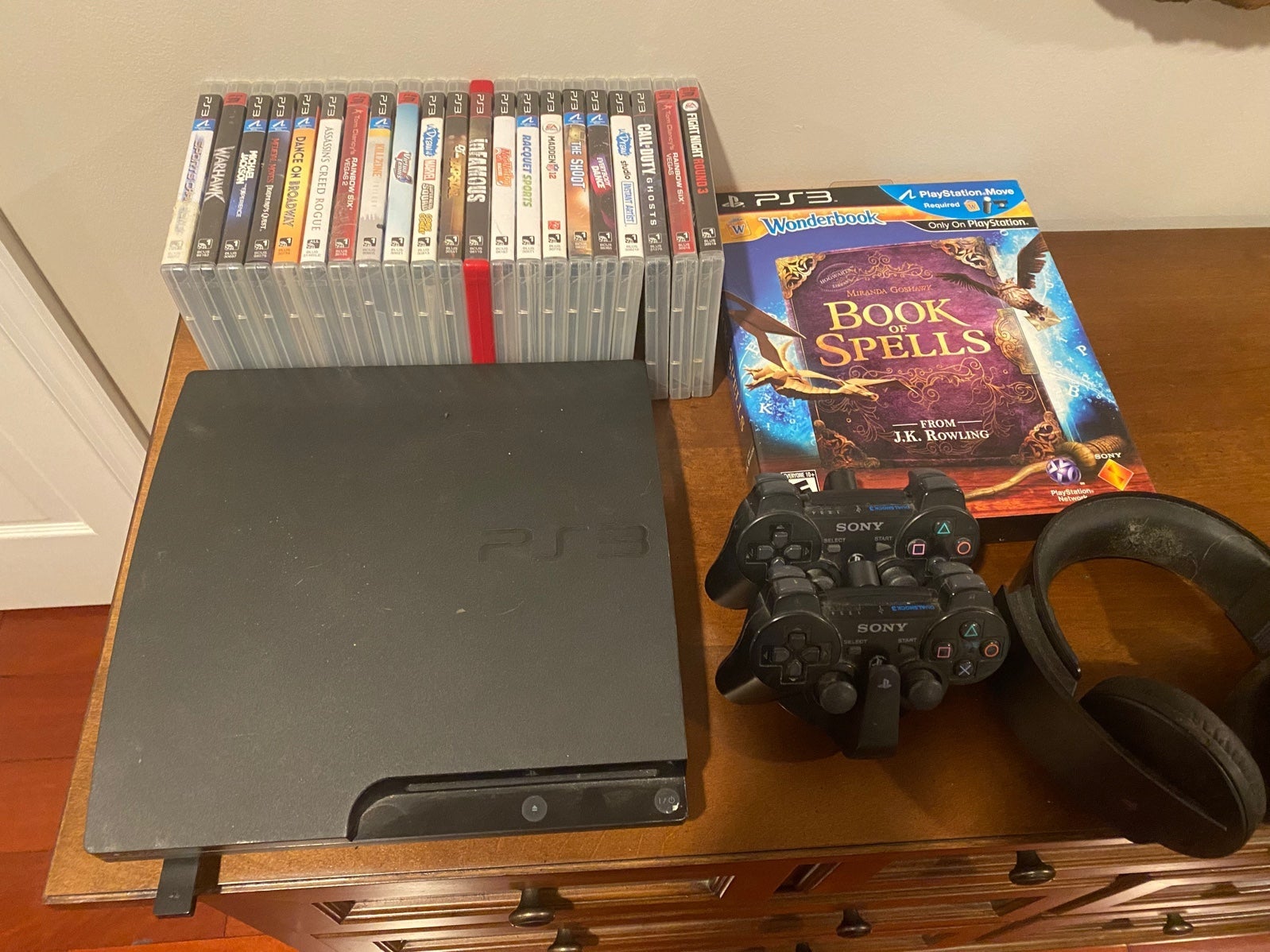 Ps3 console, 2 controllers, 21 games for PARTS