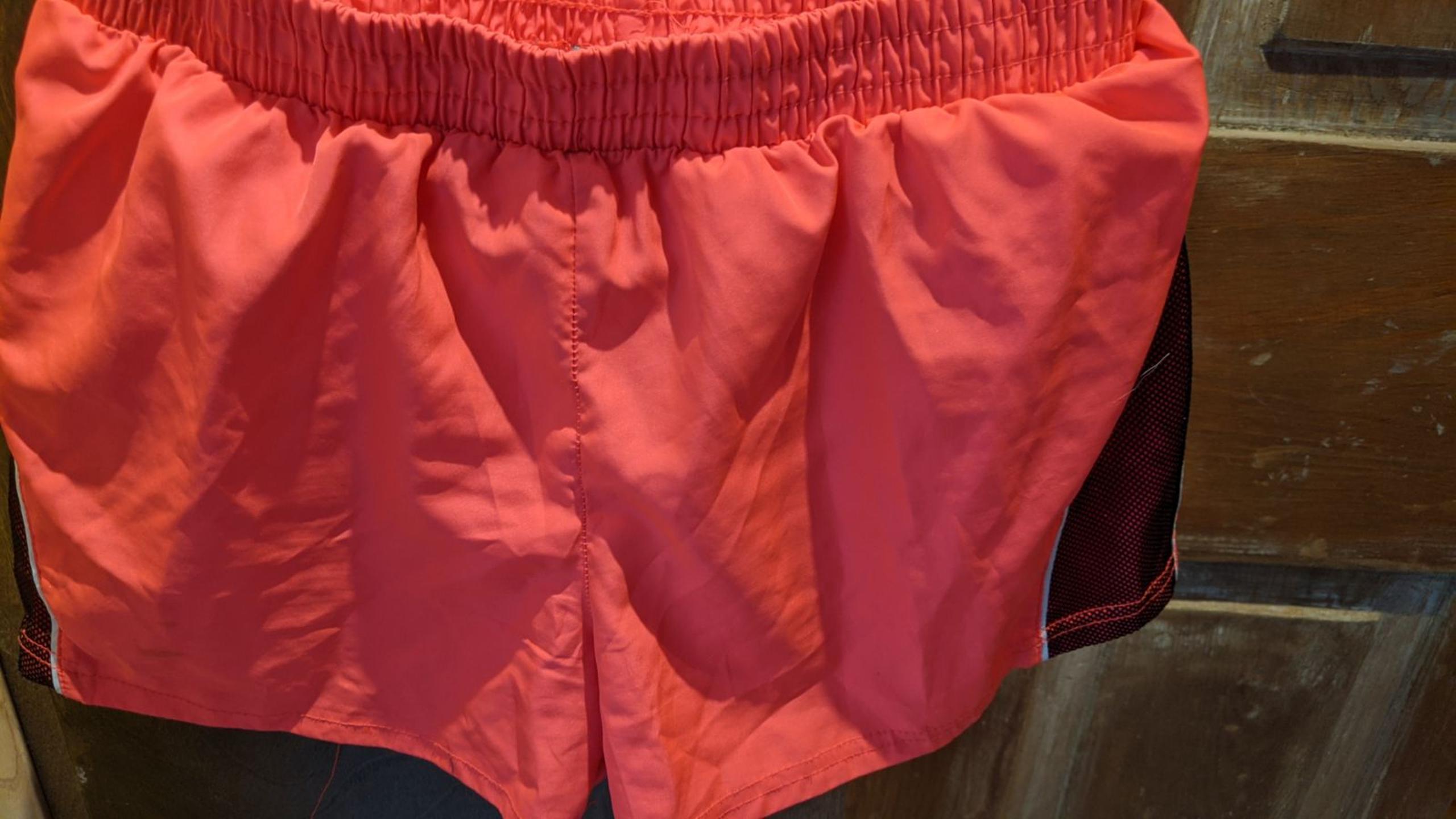 Puma brand
orangey red shorts with mesh