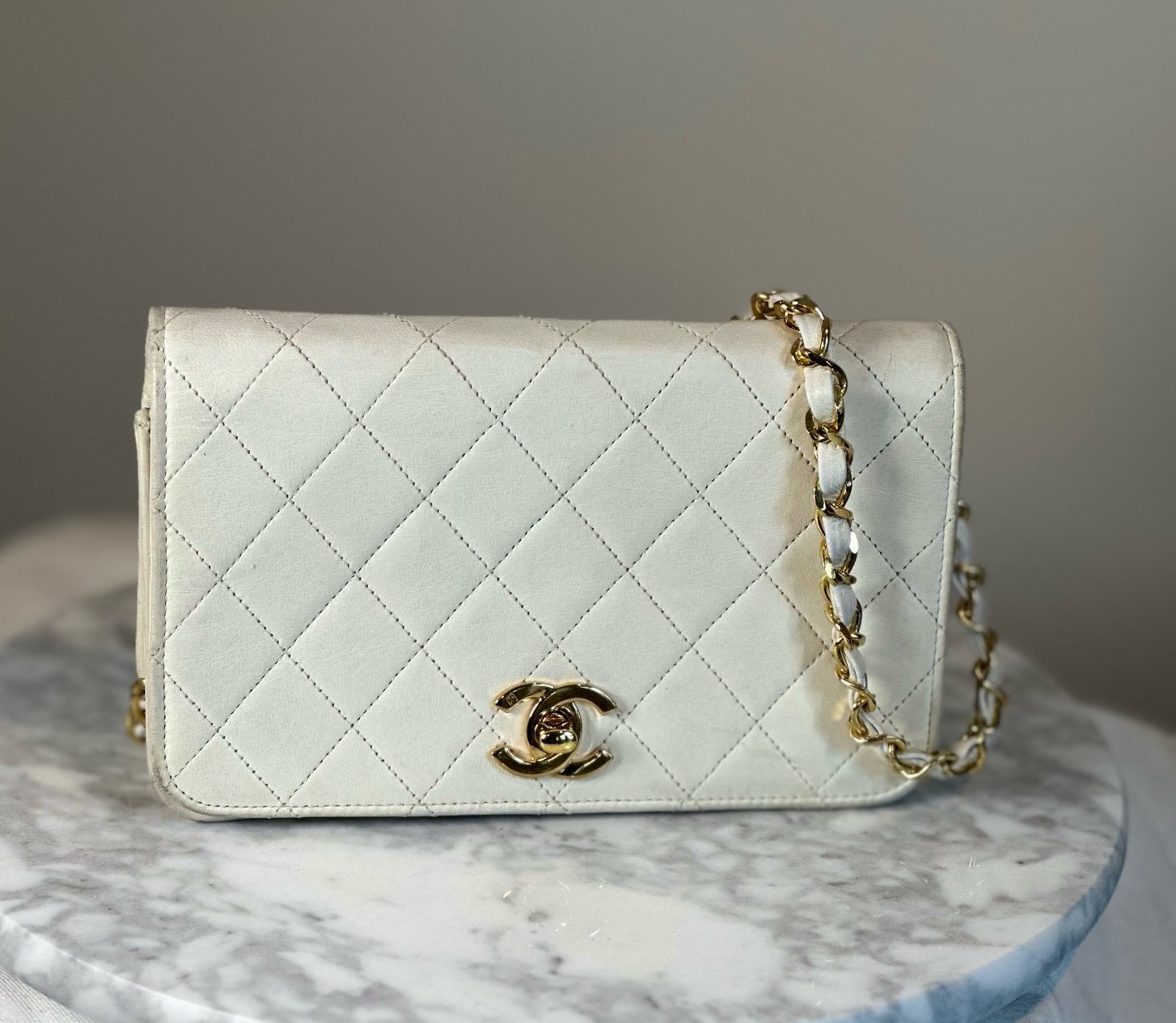 Chanel quilted cream crossbody bag