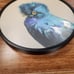 Quetzel on 8in Round Framed Wood Panel by The Mincing Mockingbird Matt Adrian
