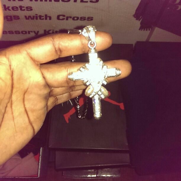 Silver chain and charm.