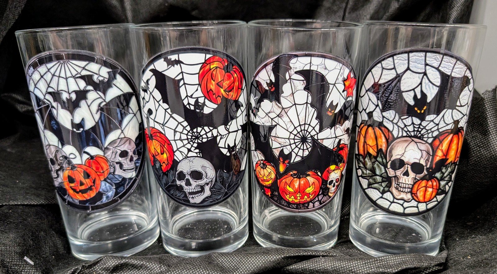 Set of 4 Halloween drinking glasses bats, pumpkins and skulls oh my!!