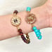 Power gemstone bracelet with Designer button