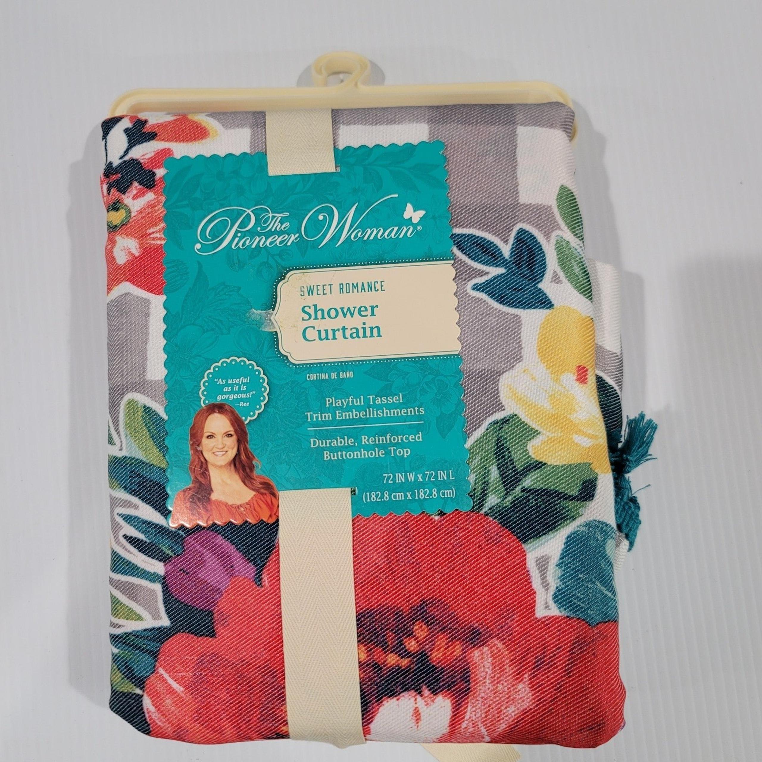Floral fabric shower curtain
Features multi-color flower prints and appliqued do