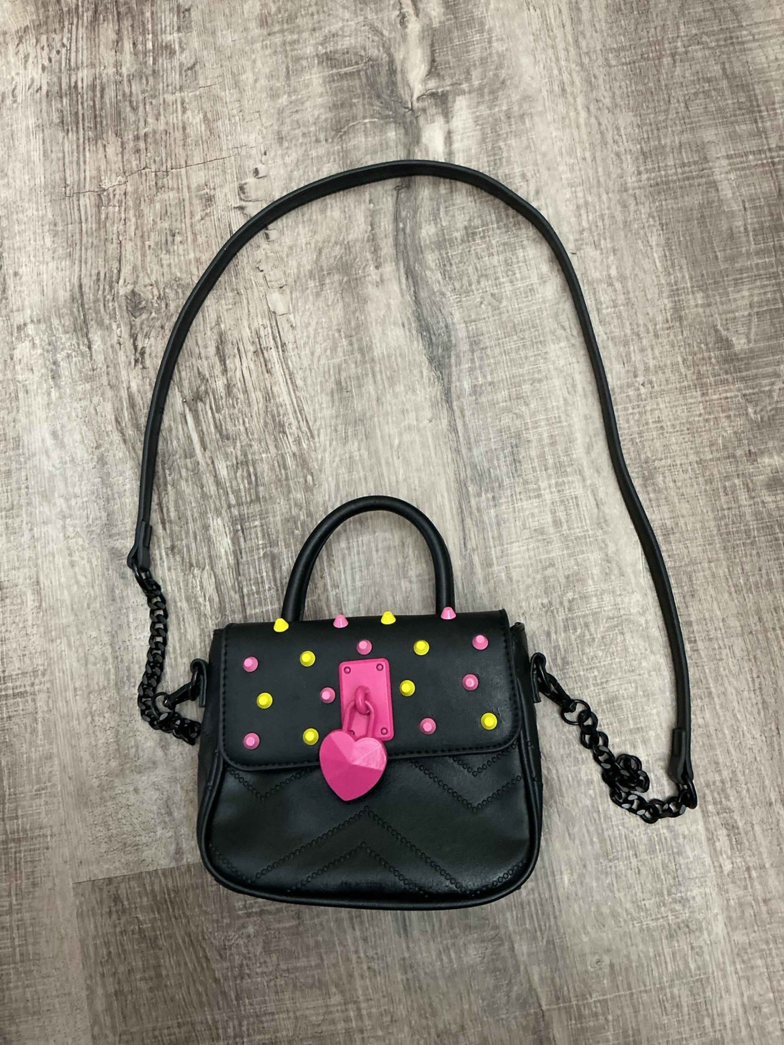 Betsey Johnson Black small handbag with pink heart locket.