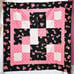 VINTAGE CRAZY QUILTS BLACK W/RED FLOWERS 45 X 45 LAP QUILT