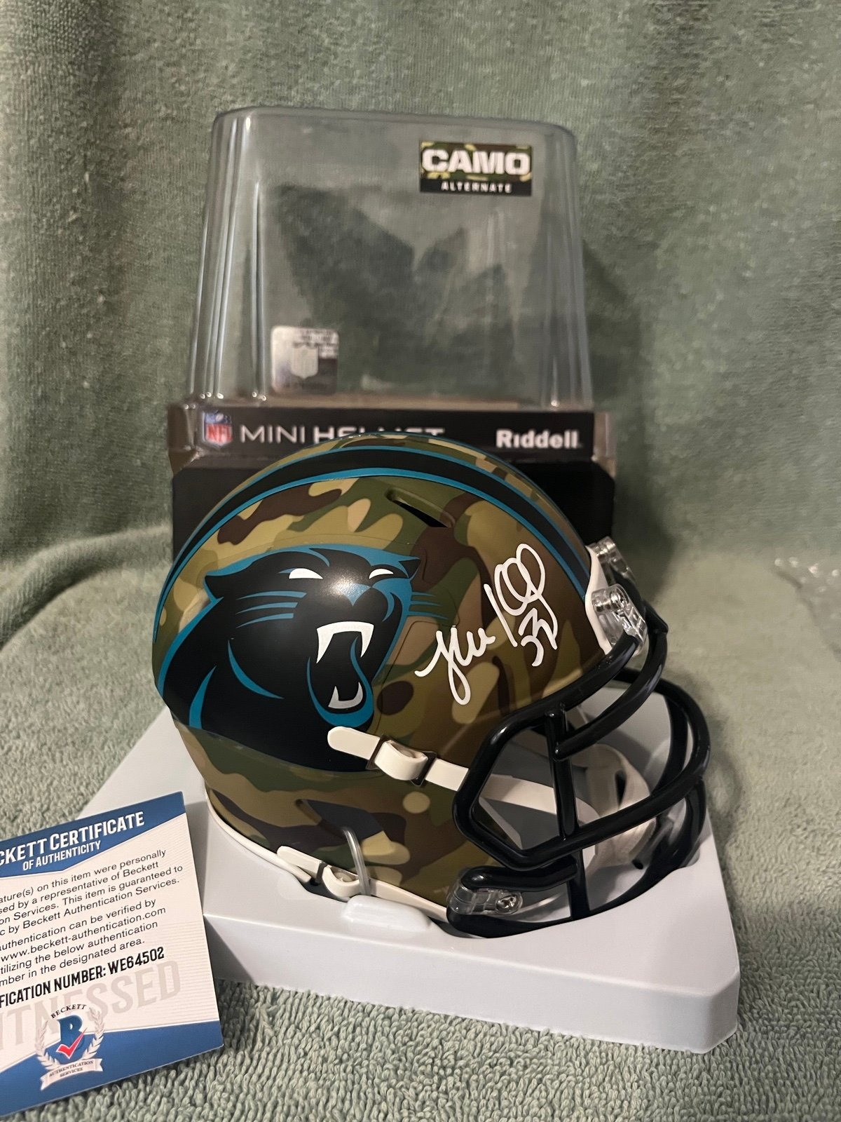 Luke kuechly signed camo mini helmet