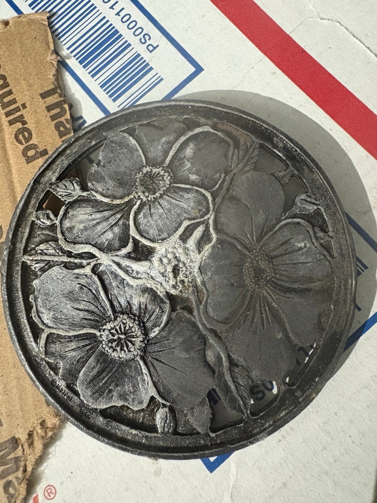 Silver cap or belt buckle