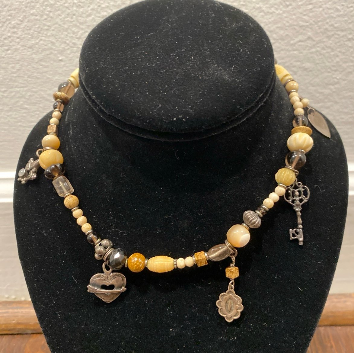 Peyote Bird necklace with 6 sterling silver charms and stones